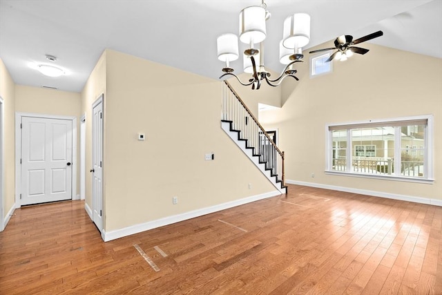 interior space featuring a healthy amount of sunlight, stairway, and light wood finished floors