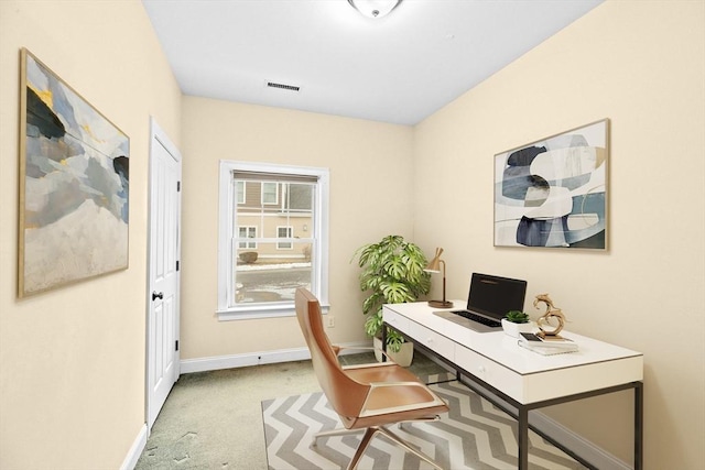 office with carpet flooring, visible vents, and baseboards