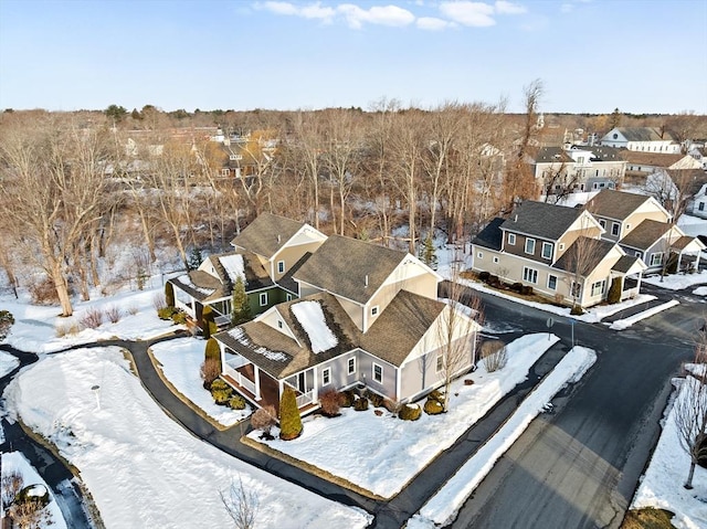 snowy aerial view featuring a residential view