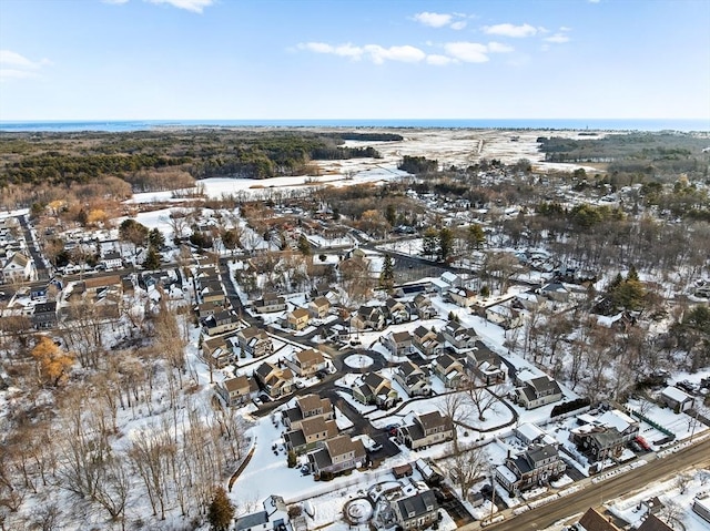 snowy aerial view featuring a residential view