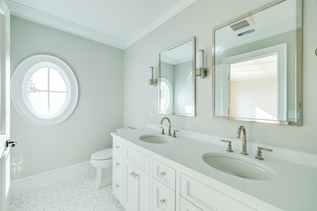 bathroom with crown molding, vanity, tile patterned floors, and toilet