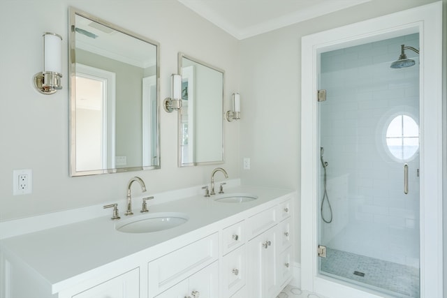 bathroom featuring ornamental molding, vanity, and a shower with door