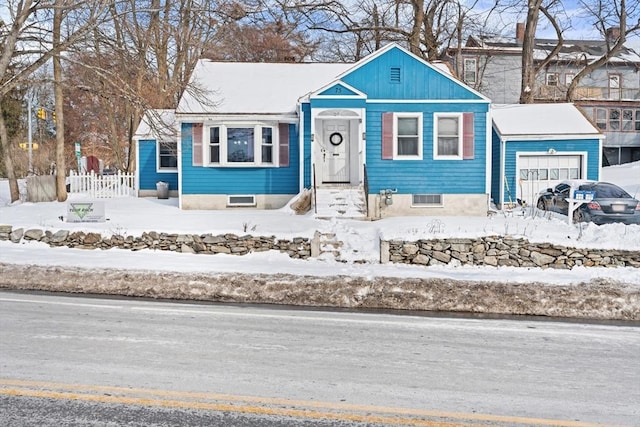 bungalow-style house with a garage