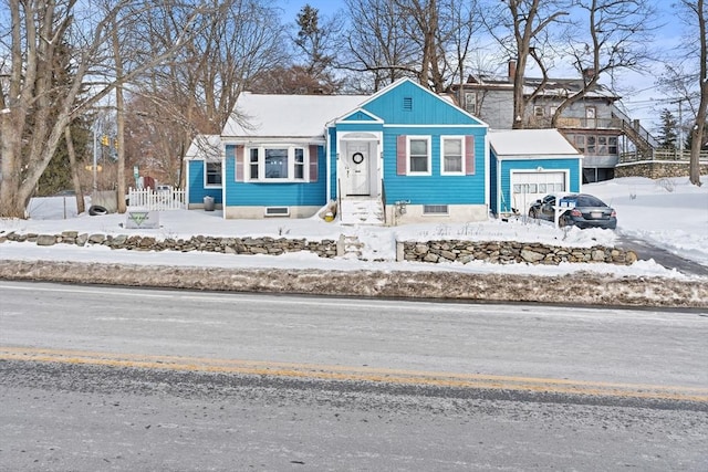 bungalow-style house featuring a garage