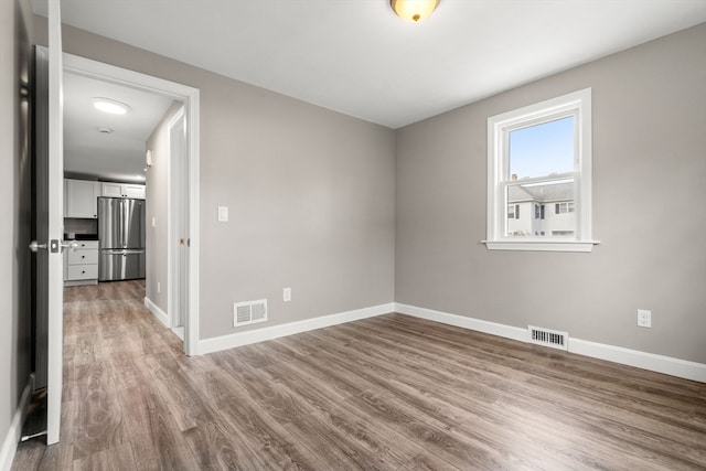 empty room featuring light hardwood / wood-style floors