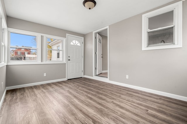 foyer entrance with light hardwood / wood-style flooring