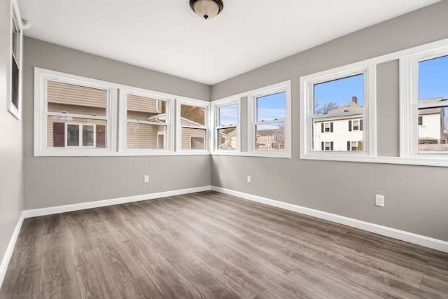 unfurnished room featuring hardwood / wood-style floors