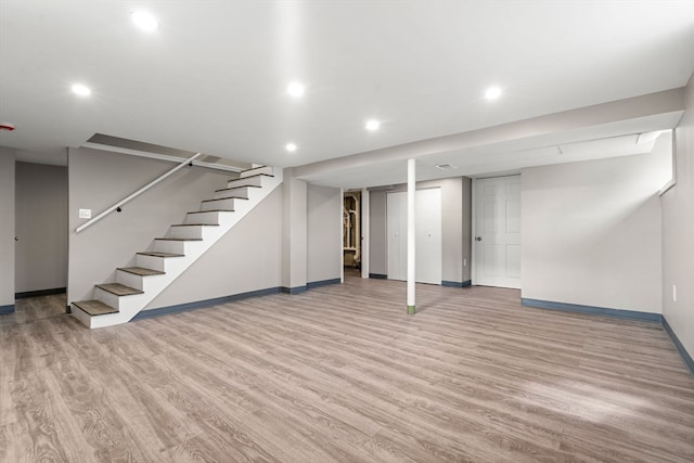 basement featuring light hardwood / wood-style floors