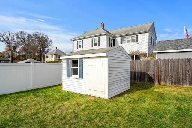 view of outdoor structure with a yard