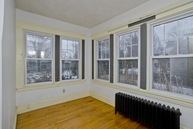 sunroom with radiator heating unit