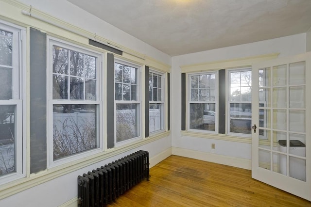 sunroom with radiator heating unit