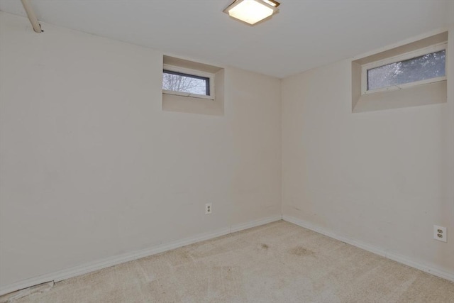 basement featuring carpet and baseboards