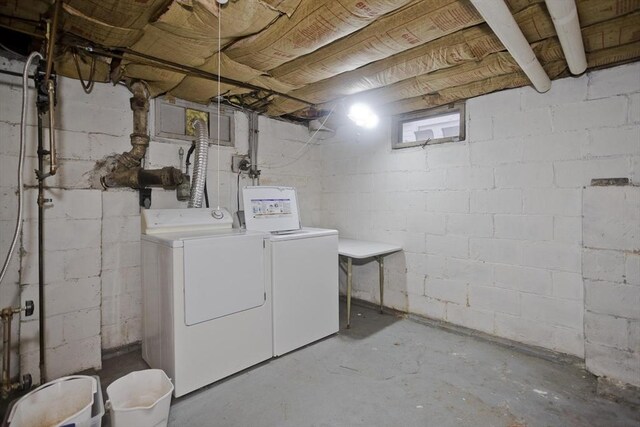 washroom featuring laundry area and separate washer and dryer