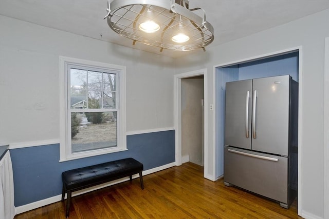 dining area featuring baseboards and wood finished floors