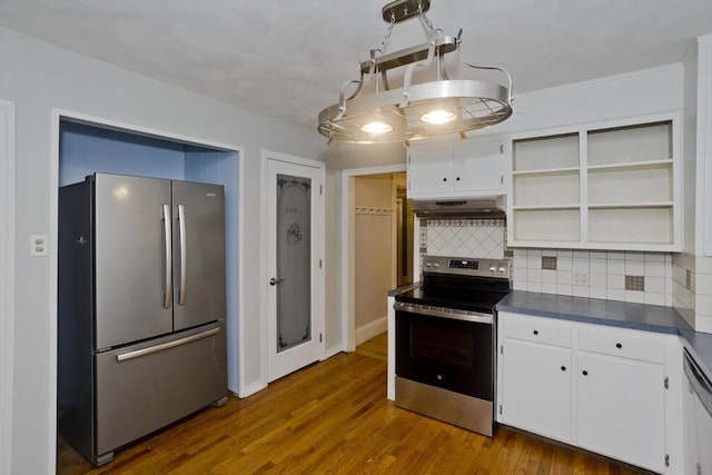 kitchen featuring dark countertops, dark wood-style floors, appliances with stainless steel finishes, under cabinet range hood, and open shelves