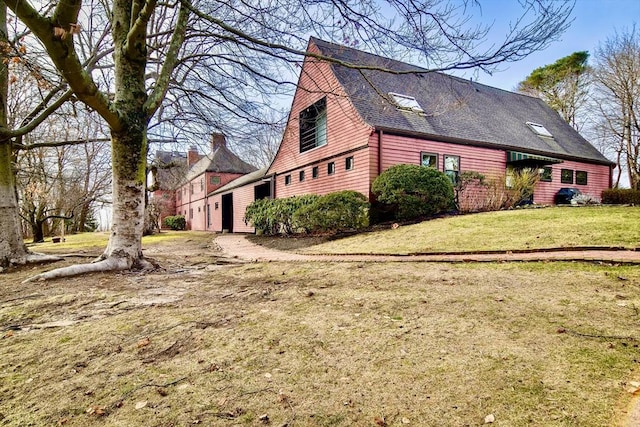 view of property exterior featuring a yard