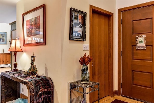 interior space with a baseboard radiator and light wood-type flooring