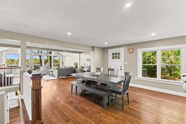 192 Furnace Ln, Pembroke, MA 02359 - dining room featuring recessed lighting, wood finished floors, plenty of natural light, baseboards, and a textured ceiling