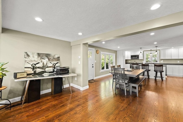 192 Furnace Ln, Pembroke, MA 02359 - dining area featuring healthy amount of natural light, wood finished floors, recessed lighting, baseboards, and a textured ceiling