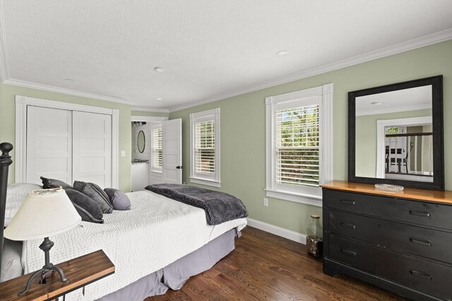 192 Furnace Ln, Pembroke, MA 02359 - bedroom featuring baseboards, dark wood-style floors, crown molding, and a closet