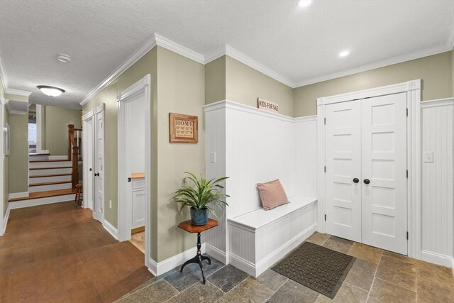 192 Furnace Ln, Pembroke, MA 02359 - mudroom with ornamental molding, stone finish floors, and baseboards