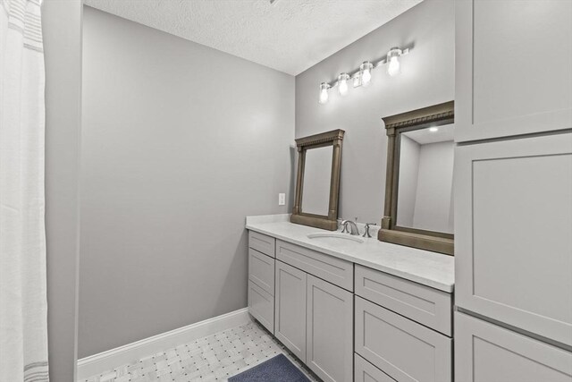 192 Furnace Ln, Pembroke, MA 02359 - full bath with baseboards, vanity, and a textured ceiling