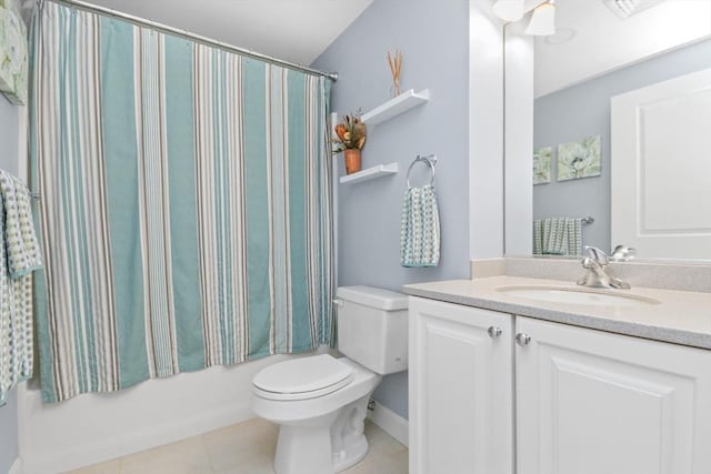 full bathroom featuring shower / bath combo with shower curtain, toilet, vanity, and tile patterned flooring