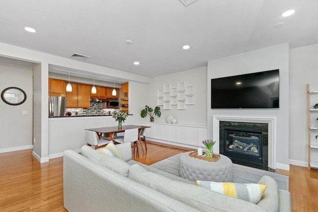 living room with light hardwood / wood-style floors