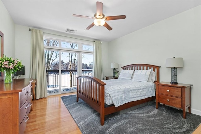 bedroom featuring ceiling fan, access to exterior, and light wood-type flooring