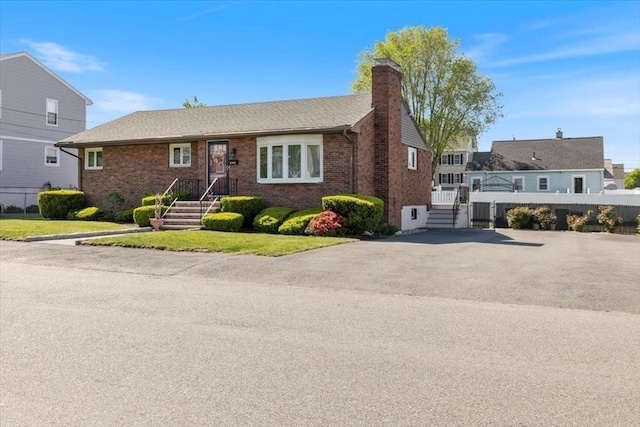 150 Gore Rd, Revere, MA 02151 - view of front facade with a chimney and brick siding