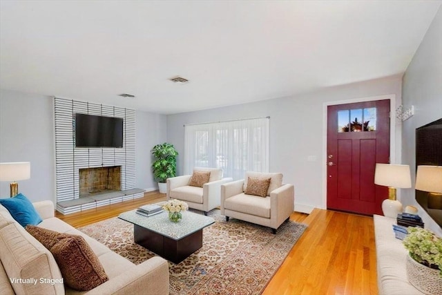 150 Gore Rd, Revere, MA 02151 - living area featuring wood finished floors and a fireplace