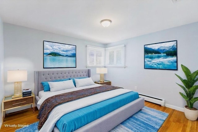 150 Gore Rd, Revere, MA 02151 - bedroom featuring baseboard heating and wood finished floors