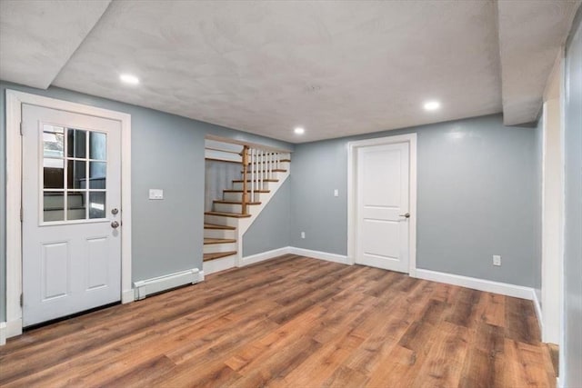150 Gore Rd, Revere, MA 02151 - finished below grade area featuring a baseboard radiator, stairs, recessed lighting, and wood finished floors