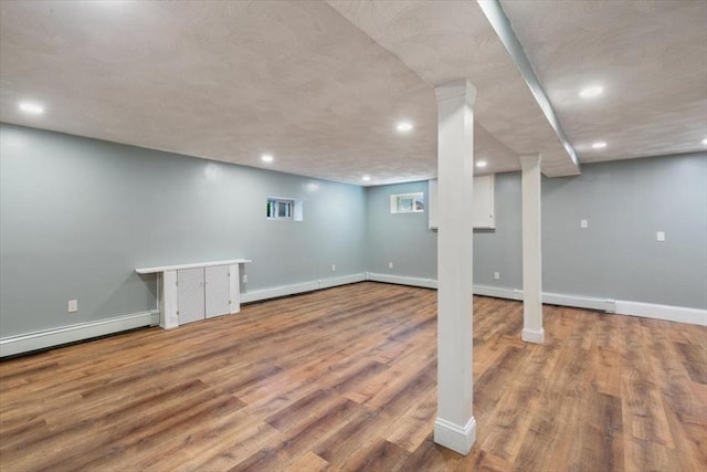 150 Gore Rd, Revere, MA 02151 - basement with recessed lighting, wood finished floors, and a baseboard heating unit
