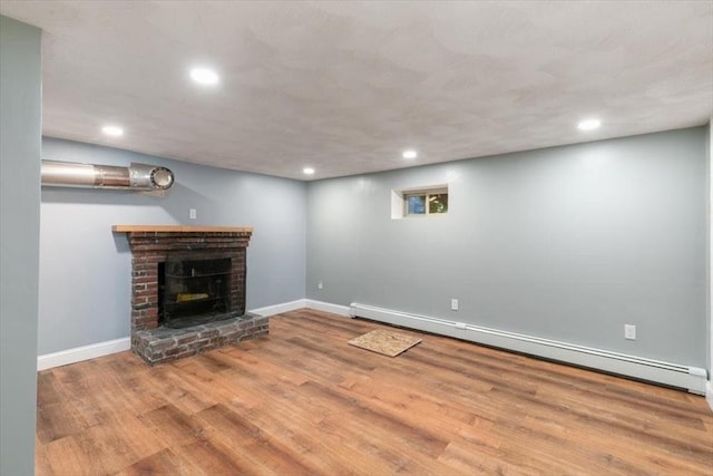150 Gore Rd, Revere, MA 02151 - unfurnished living room with baseboard heating, recessed lighting, wood finished floors, and a fireplace