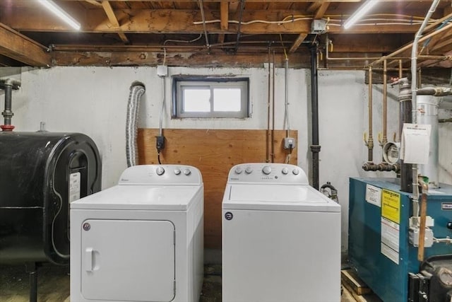 150 Gore Rd, Revere, MA 02151 - laundry area with oil tank, washing machine and clothes dryer, and a heating unit