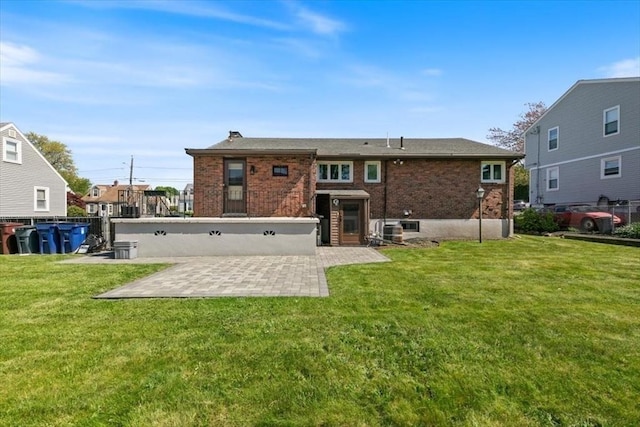 150 Gore Rd, Revere, MA 02151 - back of property featuring a patio area, brick siding, a yard, and a chimney