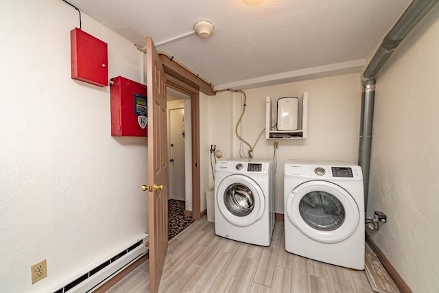 9 Hancock St Unit 1, Boston, MA 02114 - laundry area featuring light wood-type flooring, independent washer and dryer, baseboards, and a baseboard radiator