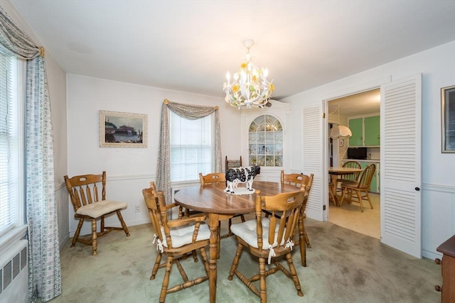 12 Bay State Rd, Natick, MA 01760 - dining area with a chandelier, carpet flooring, and radiator