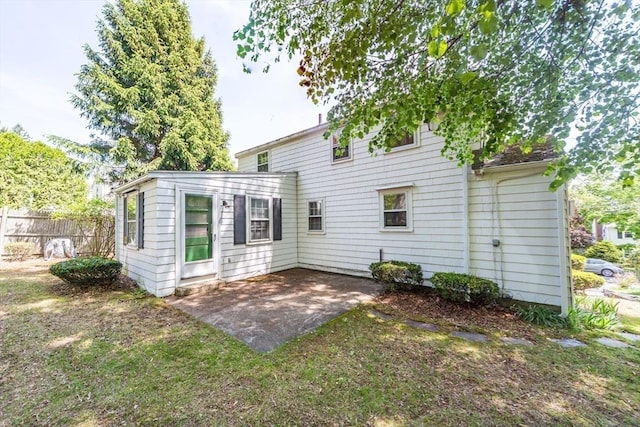 12 Bay State Rd, Natick, MA 01760 - rear view of property featuring a patio and fence