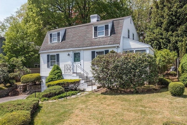 12 Bay State Rd, Natick, MA 01760 - colonial inspired home with a gambrel roof and a chimney