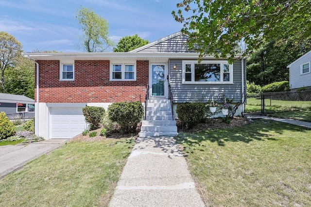 view of front of house with a garage, driveway, and brick siding