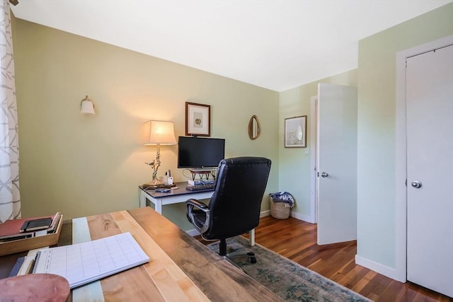 office space featuring wood finished floors and baseboards