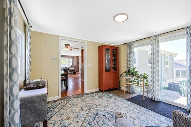 entryway with a ceiling fan and baseboards