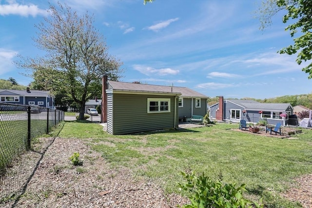 rear view of property with a chimney