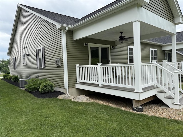 10 Soucy Dr Unit 10, Rutland, MA 01543 - view of property exterior with a ceiling fan, a lawn, a deck, and roof with shingles
