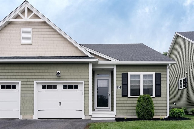 10 Soucy Dr Unit 10, Rutland, MA 01543 - view of front of house featuring roof with shingles, asphalt driveway, and entry steps