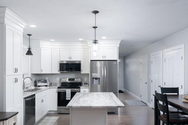 10 Soucy Dr Unit 10, Rutland, MA 01543 - kitchen with stainless steel appliances, recessed lighting, a center island, dark wood-style flooring, and white cabinetry