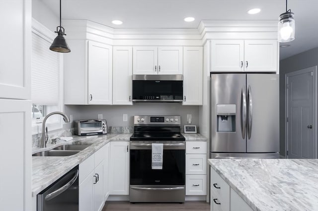 10 Soucy Dr Unit 10, Rutland, MA 01543 - kitchen with appliances with stainless steel finishes, white cabinetry, light stone counters, and recessed lighting