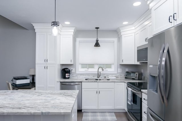 10 Soucy Dr Unit 10, Rutland, MA 01543 - kitchen featuring appliances with stainless steel finishes, white cabinets, recessed lighting, pendant lighting, and light stone countertops
